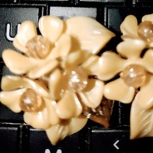 Gorgeous 1940s celluloid clip-on earrings of a beautiful floral flower